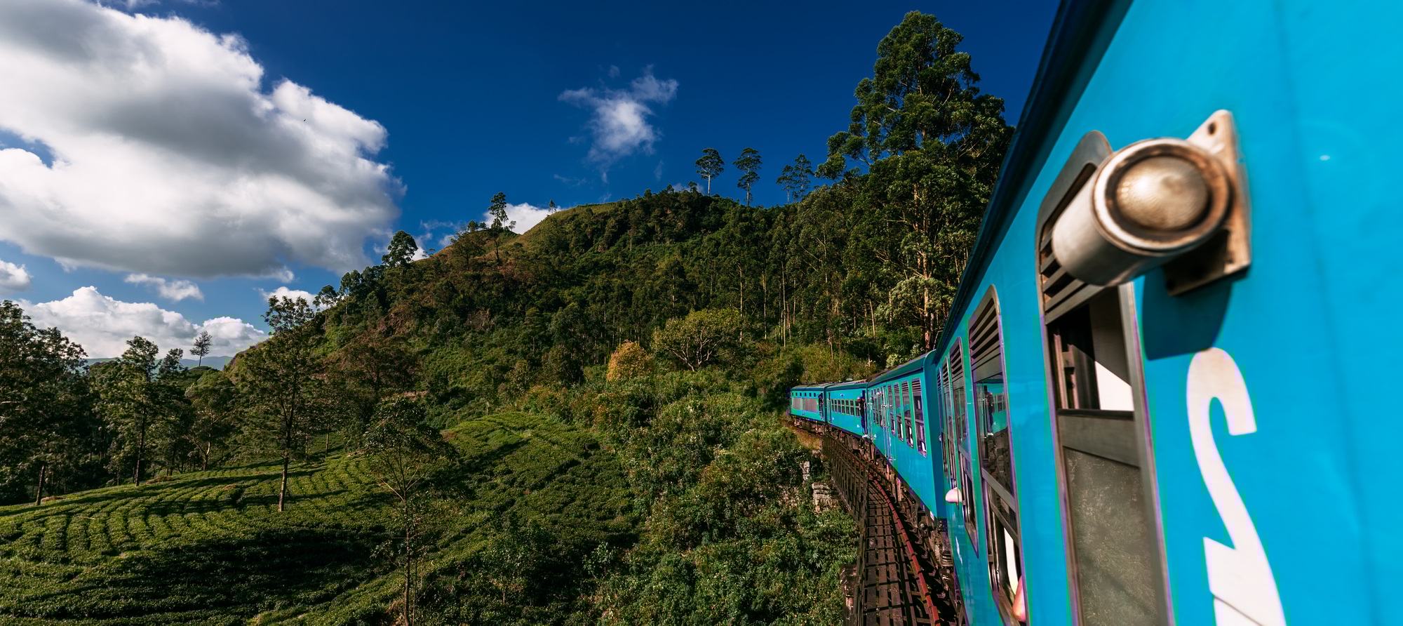 Blue train in Sri Lanka, panorama. Train from Ella in Nuwara Eliya in Sri Lanka island Blue train in Sri Lanka, panorama. Train from Ella in Nuwara Eliya in Sri Lanka island