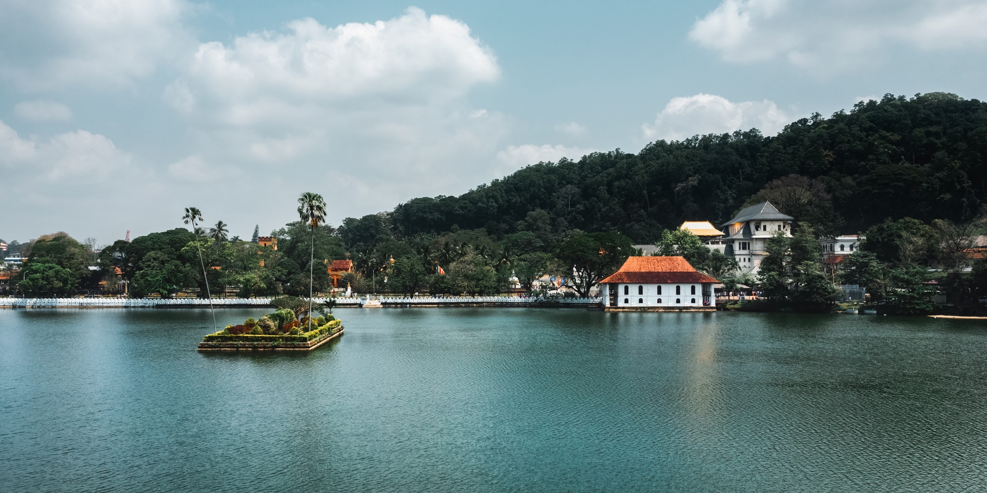 Skyline aerial view of Kandy lake and famous city landmark Sri Dalada Maligawa, Sacred Tooth Relic Skyline aerial view of Kandy lake and famous city landmark Sri Dalada Maligawa, Sacred Tooth Relic