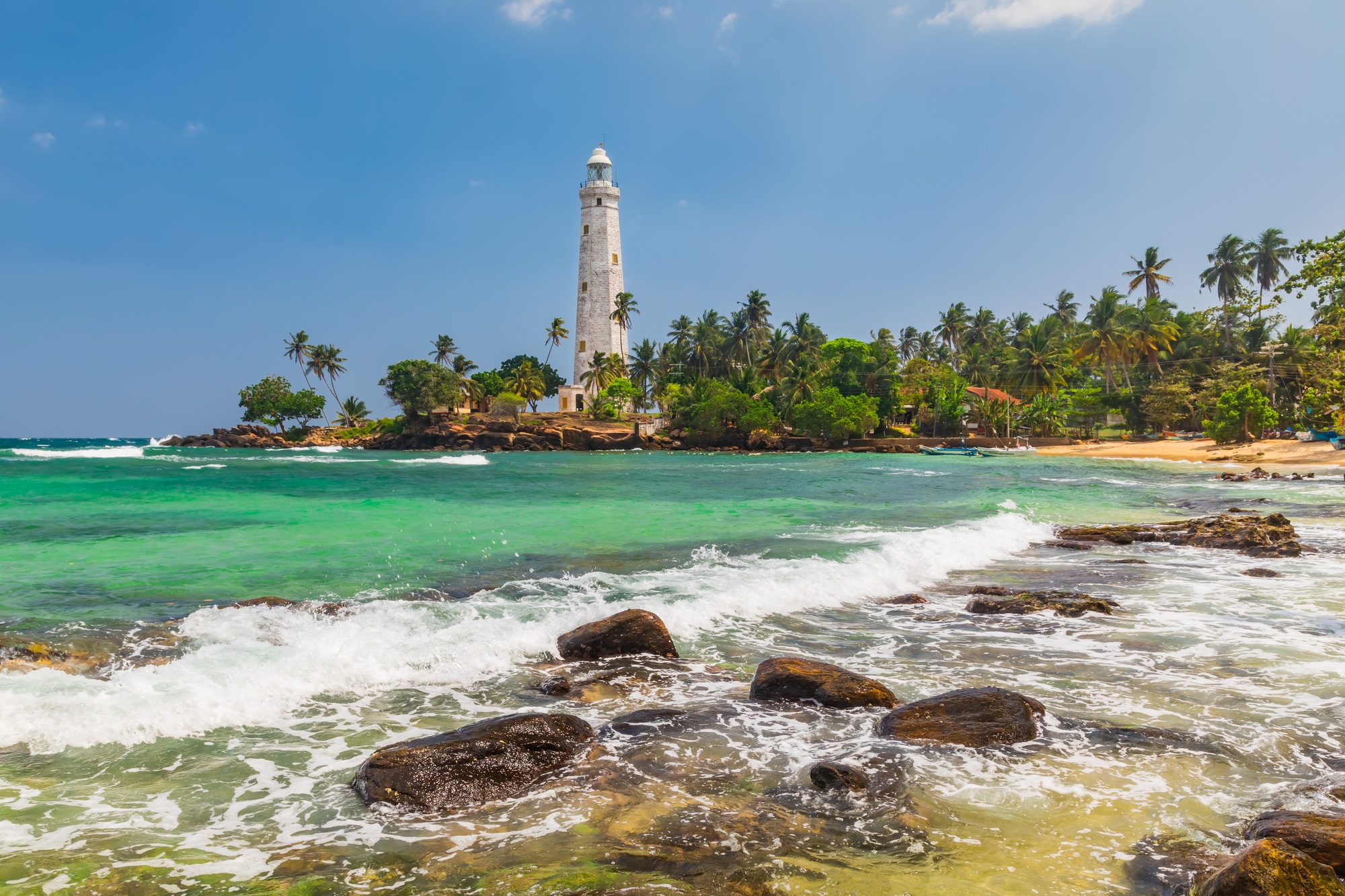 White lighthouse Dondra Head and tropical palms, Sri Lanka, near Matara. White lighthouse Dondra Head and tropical palms, Sri Lanka, near Matara.